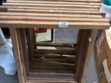 a wooden table with a lot of boxes on the ground