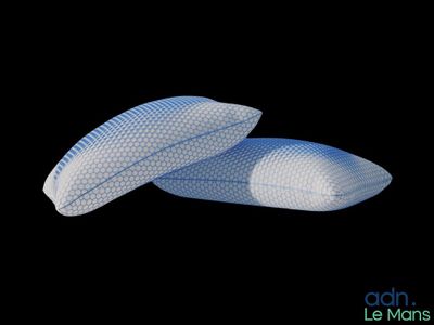 a pair of pillows sitting on top of each other on a black surface