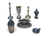 a lot of silver objects on a white surface