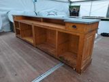 a wooden counter with a sink on top of it