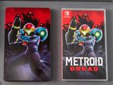 two nintendo wii games are sitting next to each other on a table