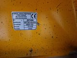 a close up of a label on a yellow machine
