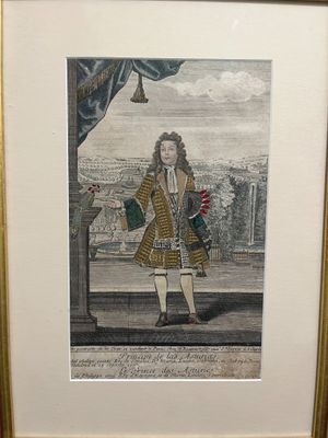 an old picture of a man in a coat holding a flower