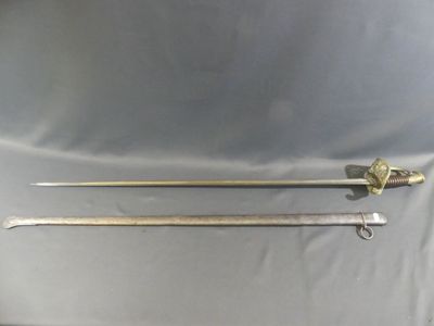 two swords are sitting on a table next to each other