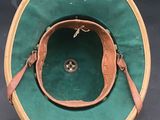 an image of a green hat with a leather strap