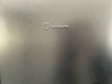 a close up of a silver laptop on a table