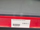 a picture of a red and green phone on a shelf