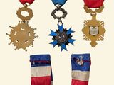 a group of medals that have been placed on a white background