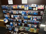 a display of various electronics on a shelf in a store