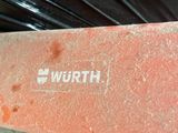 a close up of a red brick with the word worth on it