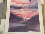a picture of a picture of a sunset on a table