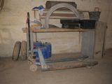 a wooden shelf with tools on it in a room