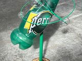 a bottle that is sitting on top of a metal stand