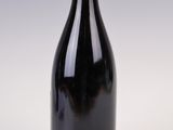 a bottle of wine that is sitting on a table