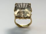 a close up of a ring with a stone in it