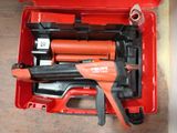 a red tool box with tools in it on the floor
