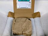 a cardboard box with a piece of paper in it