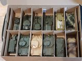 a box full of toy army vehicles in it