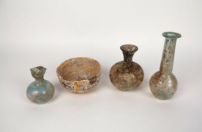 several different types of vases and bowls on a white surface