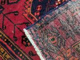 an image of a close up of a red and blue rug