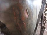 a close up view of a motorcycle with rust on it
