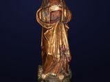 a statue of a woman holding a baby in her arms