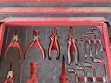 many tools in a case that are sitting on the floor