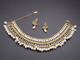 a gold and pearl necklace and earring set