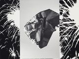 black and white photograph of fireworks exploding in the sky with a picture of a bat