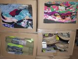 two boxes that have clothes in them on top of each other