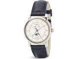 un gros plan d'une montre-bracelet avec une lune sur le cadran