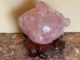 a small pink rock sitting on top of a table
