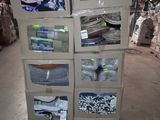 boxes of clothing are stacked on top of each other in a warehouse