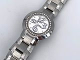 an image of a close up of a wrist watch on a white surface