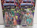 two action figures of two characters from the teenage mutants series