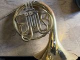 a brass instrument that is laying on a table