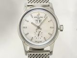 a close up of a silver watch with a white dial