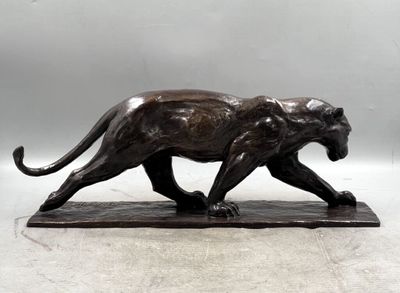 bronze sculpture of a panther on a marble base
