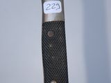 a close up of a knife with a number on it