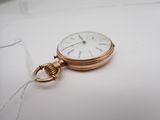 an image of a gold pocket watch with a chain around it