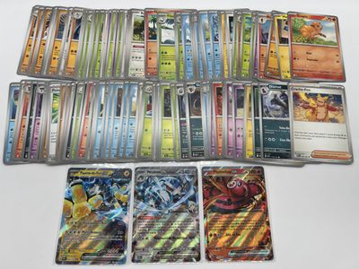 a close up of a collection of pokemon cards on a table