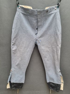 a close up of a pair of pants hanging on a clothes line