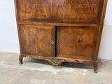 a wooden cabinet with a door and a drawer on it