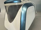 a white and blue machine that is sitting on a table