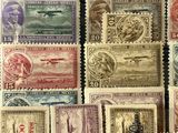 several different types of stamps are displayed on a black surface