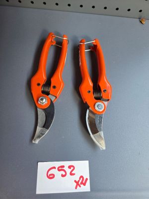 two orange pliers that are on display in a store