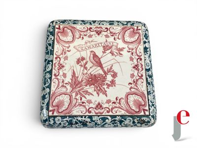 a red and white box with a bird design on it