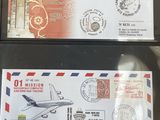 three different airmail envelopes with stamps on them on a table