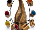 a wooden vase with cups in it on a wire stand