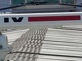 a boat that is sitting on the dock by the water